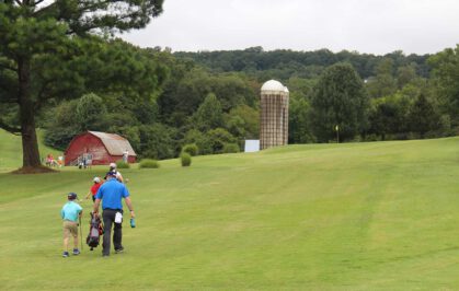 Golfers walking on fairway at Beverly Park Golf Course.